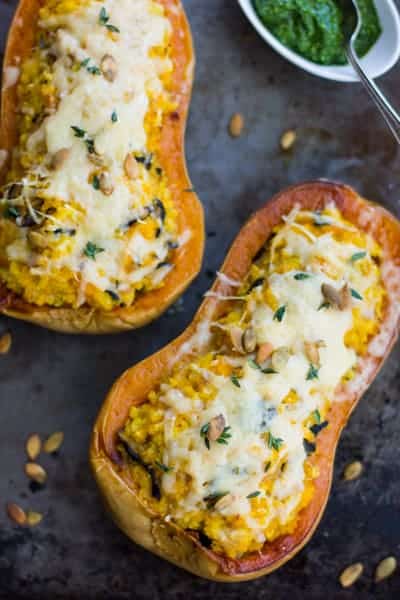 top down shot of Vegetarian Stuffed Butternut Squash with Mushrooms, Millet, and Kale Pesto 