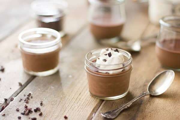 Chocolate and Coconut Milk Pots de Crème on table 