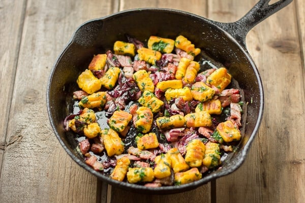 skillet full of Gluten-Free Pumpkin Ricotta Gnocchi with Pancetta and Seared Radicchio