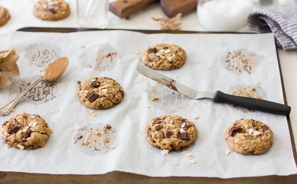 Chocolate Chip Almond Butter Cookies with Buckwheat, Maple, and Oats {Vegan and Gluten-Free} on parchment