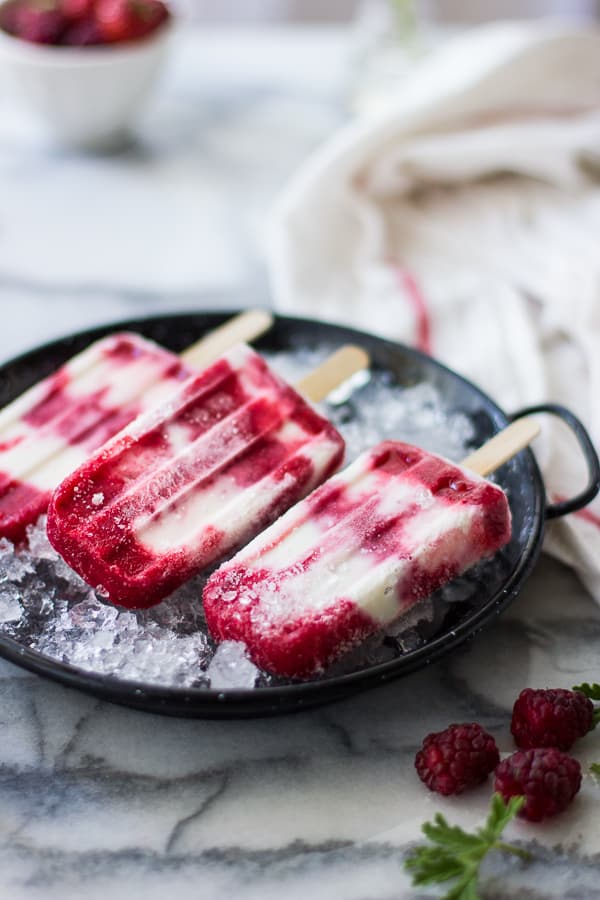 close up of Tayberry, Rose Geranium + Buttermilk Popsicles