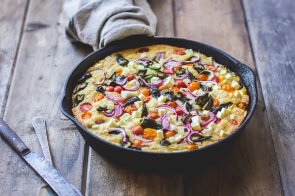 A Farmer's Market Cornbread with Sweet Corn, Cherry Tomatoes and Sheep's Cheese {Gluten-Free} on a skillet