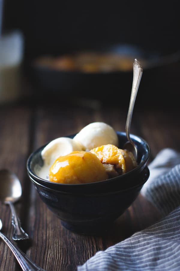 Vanilla Buttermilk Ice Cream in a bowl with peach cobbler