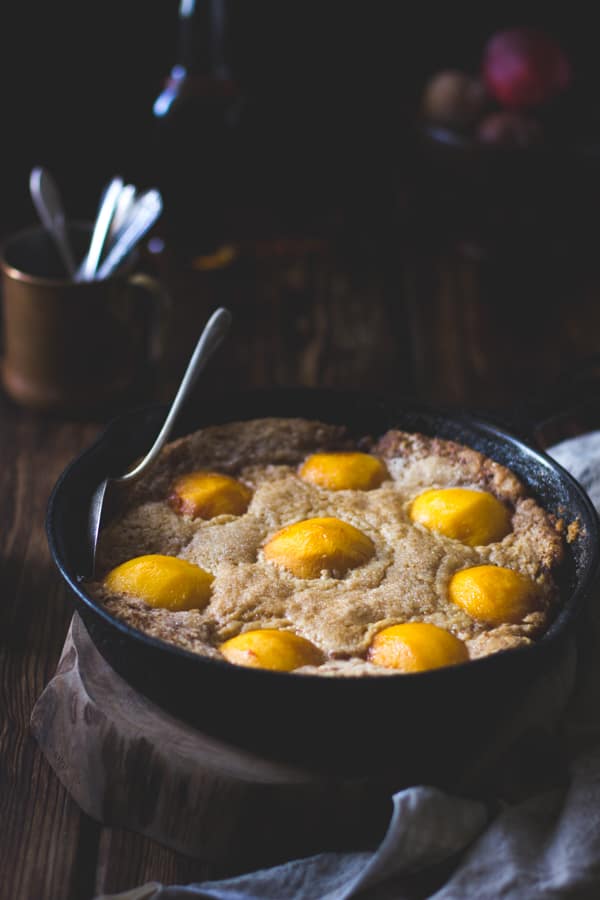 Southern-Style Peach Cobbler with Maple Sugar, Bourbon + Brown Butter {Gluten-Free} in skillet