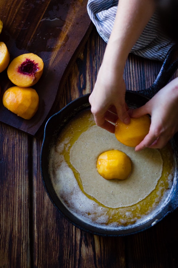 placing peaches in skillet 
