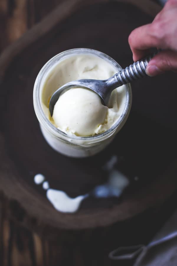 buttermilk ice cream being scooped from jar