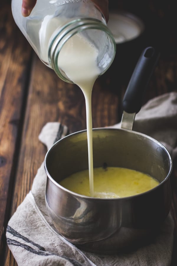 pouring cold buttermilk into hot custard