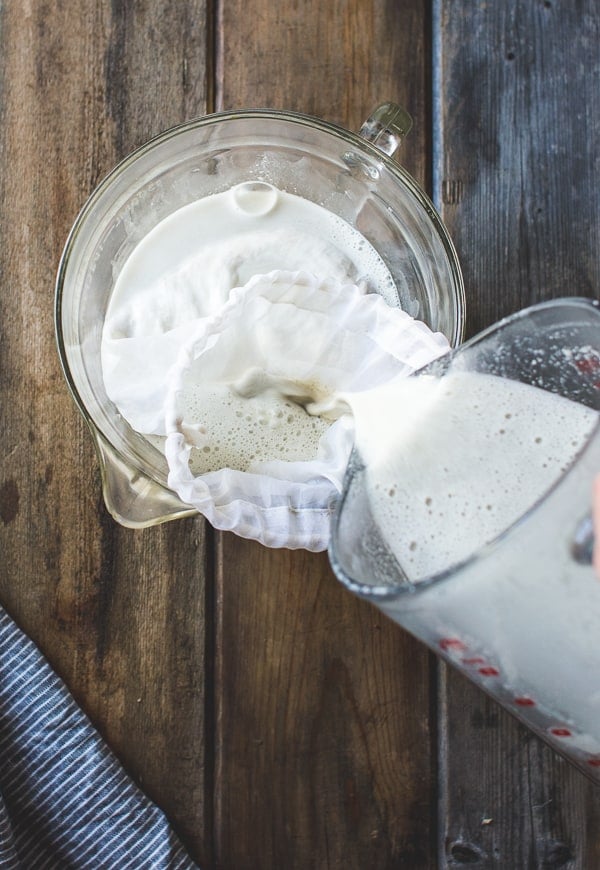 pouring horchata into bowl