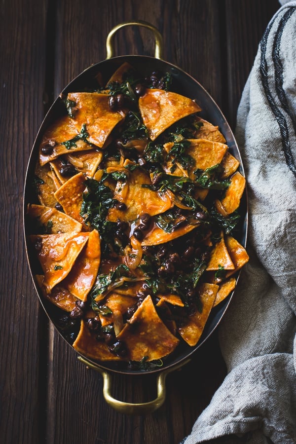 Baked Chilaquiles with Black Beans and Kale in big pan