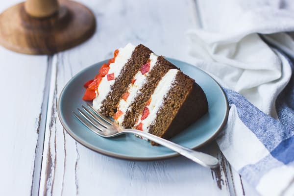 slice of Two-Persimmon Layer Cake with Vanilla Bourbon Cream Cheese Frosting 