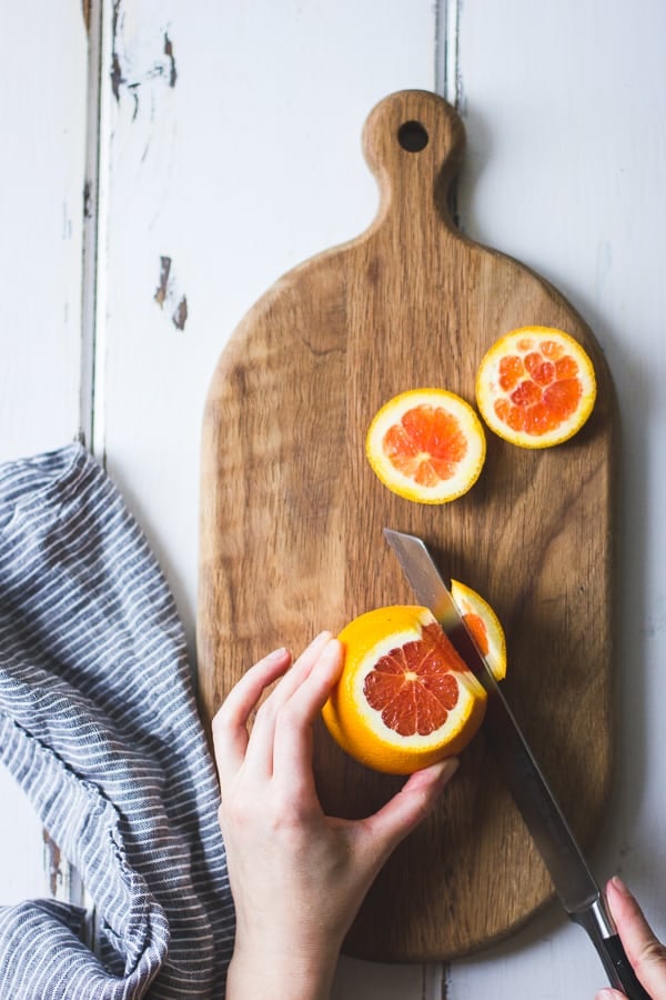 slicing fruit on board 