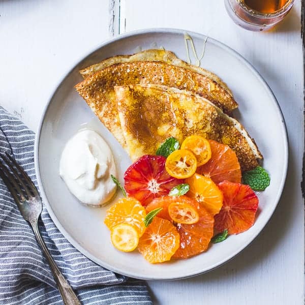 Gluten Free Crepes With Ricotta, Citrus, and Honey on plate