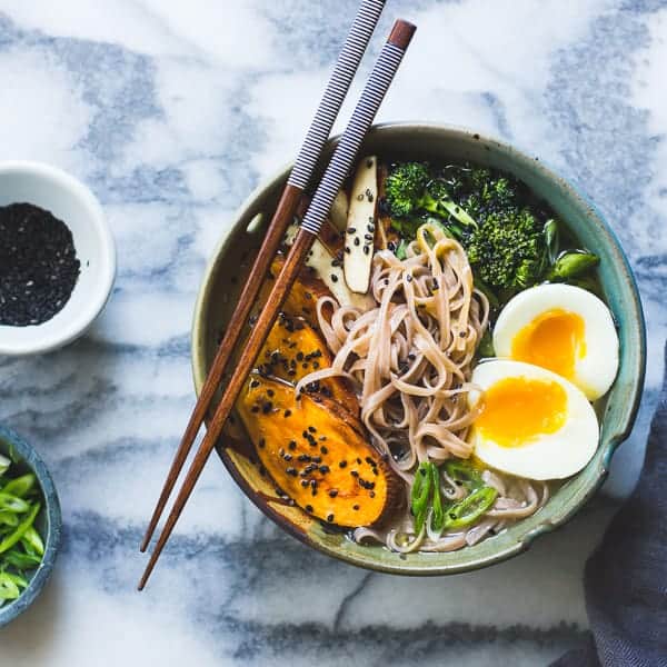 a bowl of delicious Vegetarian Miso Ramen with Rice Noodles, Roasted Sweet Potatoes + Sesame Broccolini