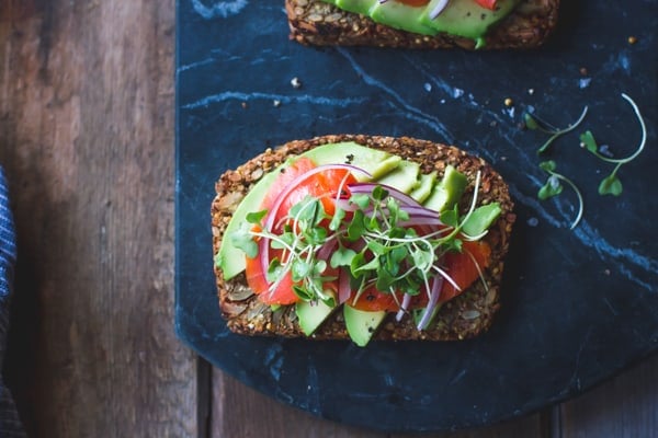 Multi-Grain Nut + Seed Bread with tomato and avocado topping