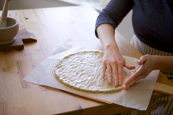 pressing pizza crust