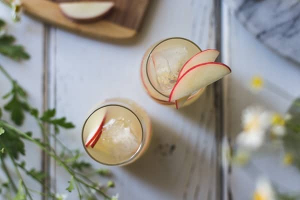 top down shot of White Nectarine Prosecco Sangría with Ginger & Elderflower