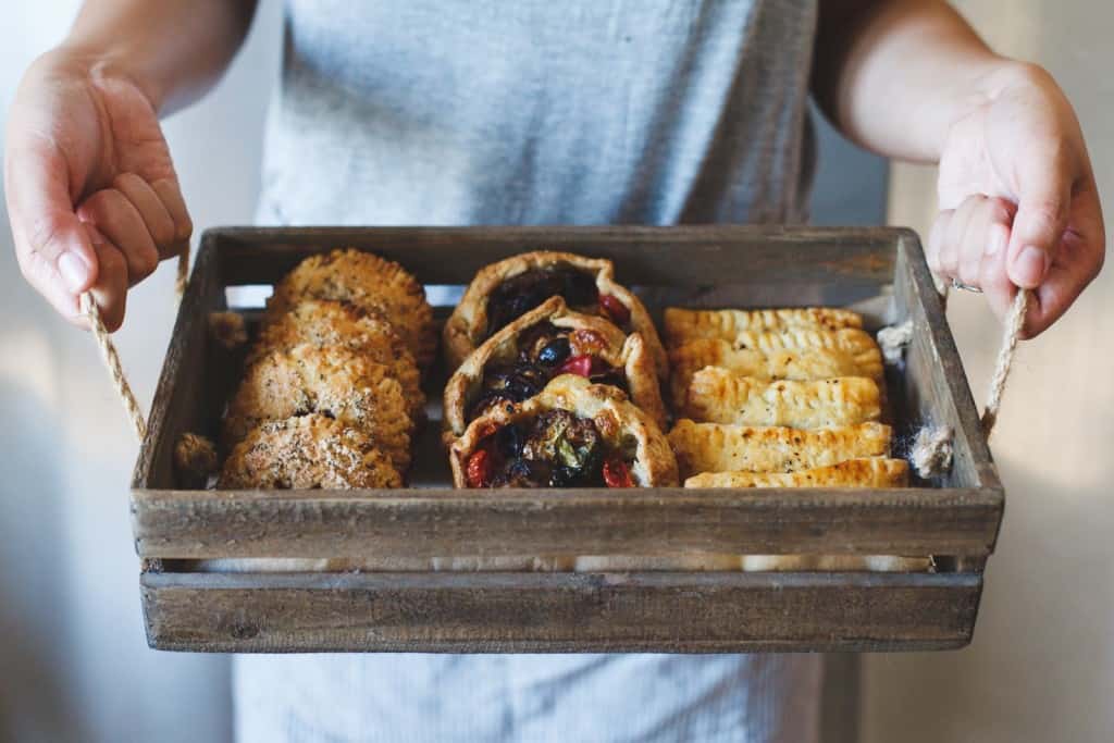 holding box of pies 