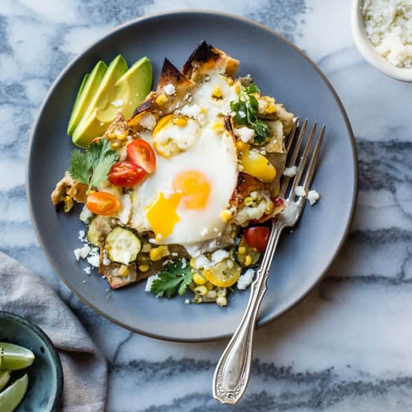 Baked Green Chilaquiles with Sweet Corn + Summer Squash on a plate