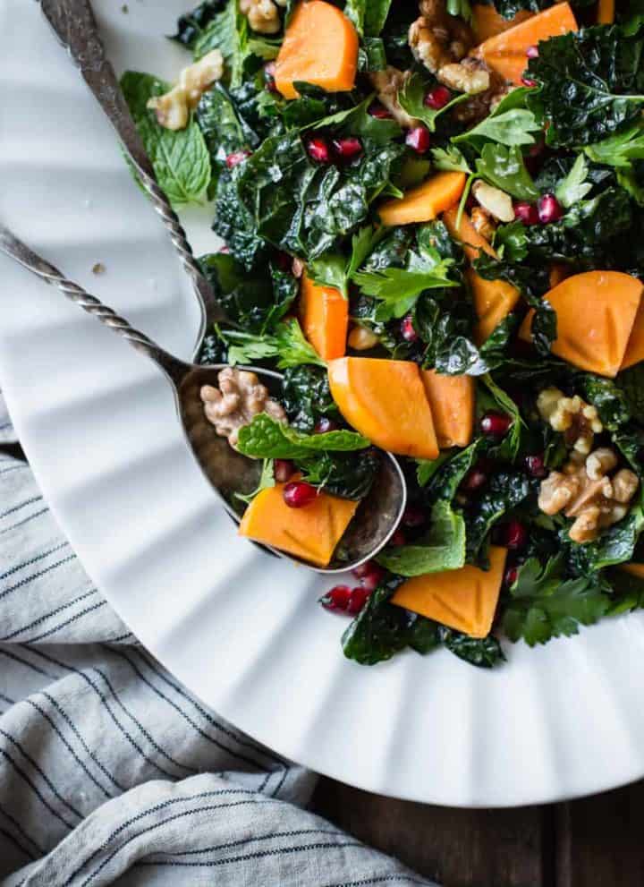 Herbed Kale Salad with Persimmon, Pomegranate and Maple-Cumin Dressing
