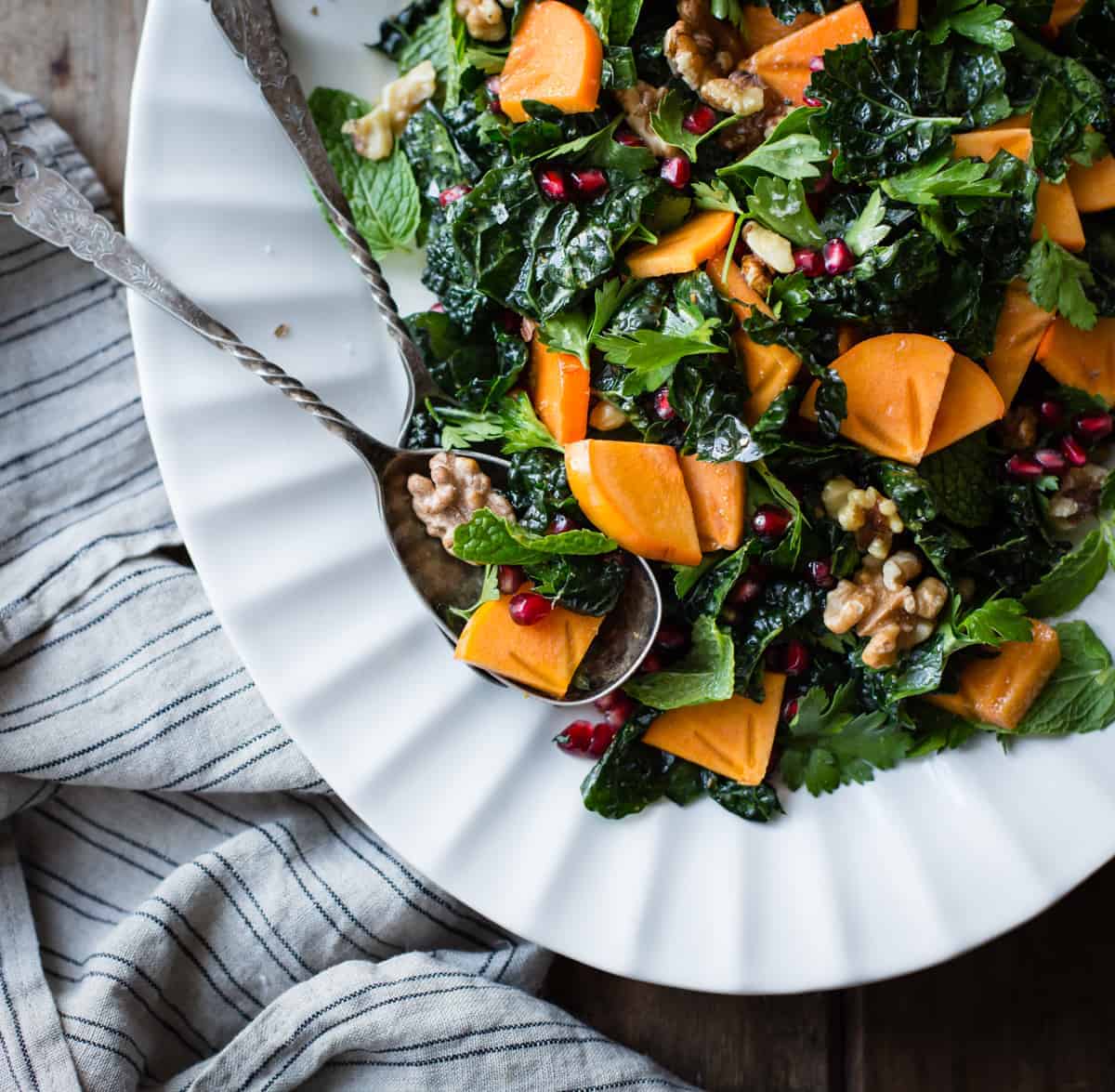 fresh and delicious Herbed Kale Salad with Persimmon, Pomegranate and Maple-Cumin Dressing