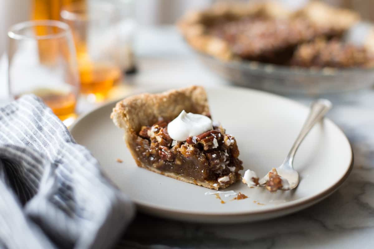 slice of Bourbon Sorghum Pecan Pie {with a gluten-free sorghum crust} on plate