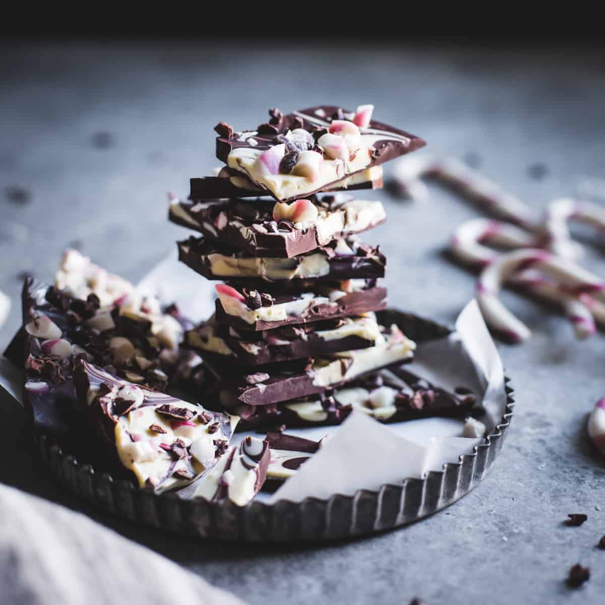 pile of All-Natural Dark Chocolate Peppermint Bark with Cacao Nibs and Flaky Salt