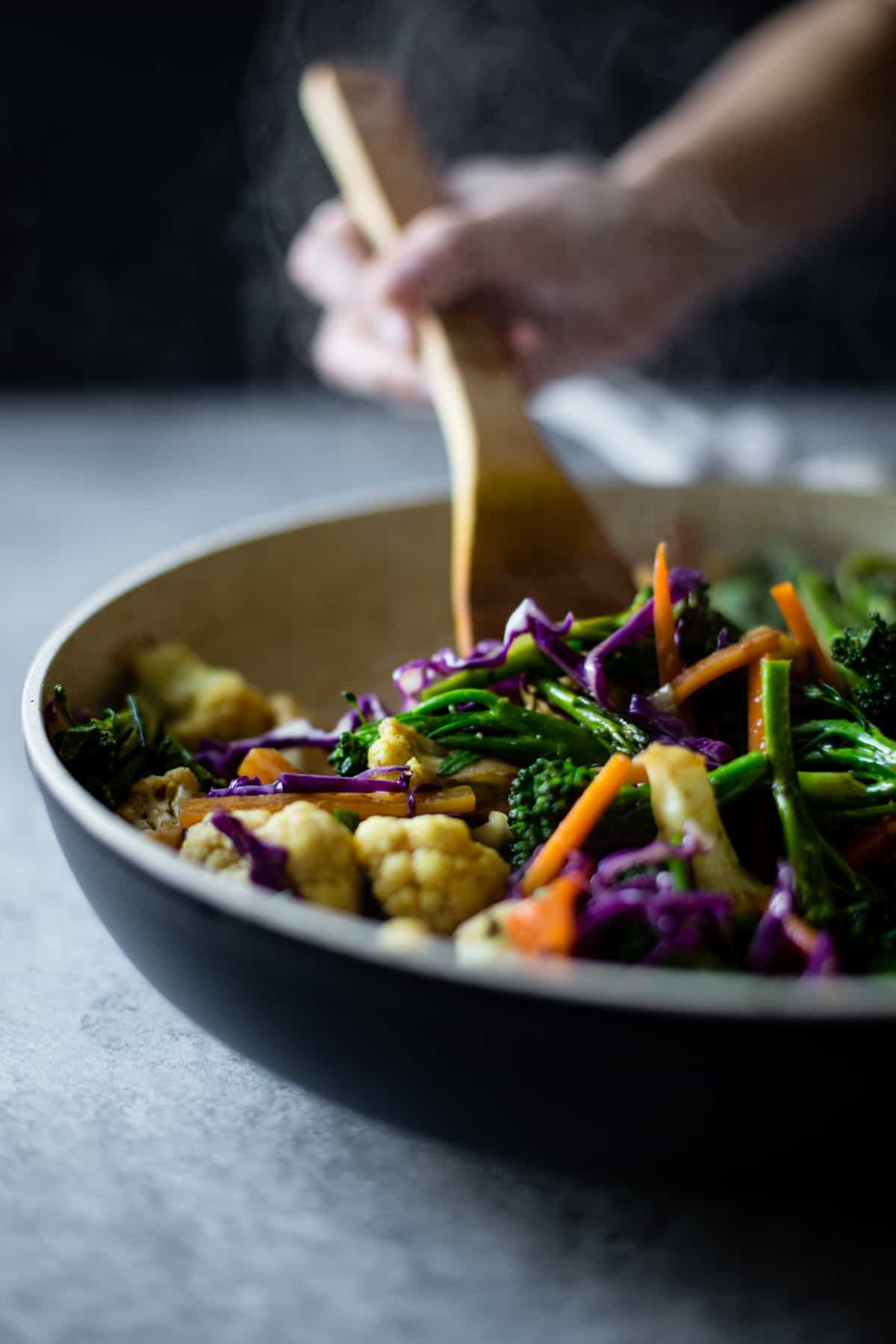 stirring pan of Curried Noodles with Crispy Tofu & Winter Vegetables {gluten-free & vegan}