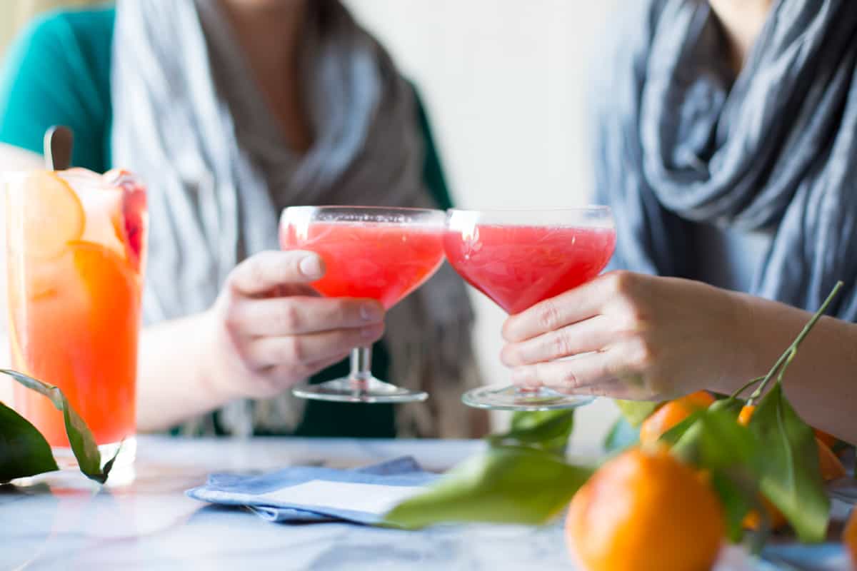 people holding glasses of Sparkling Citrus, Lillet & Prosecco Punch