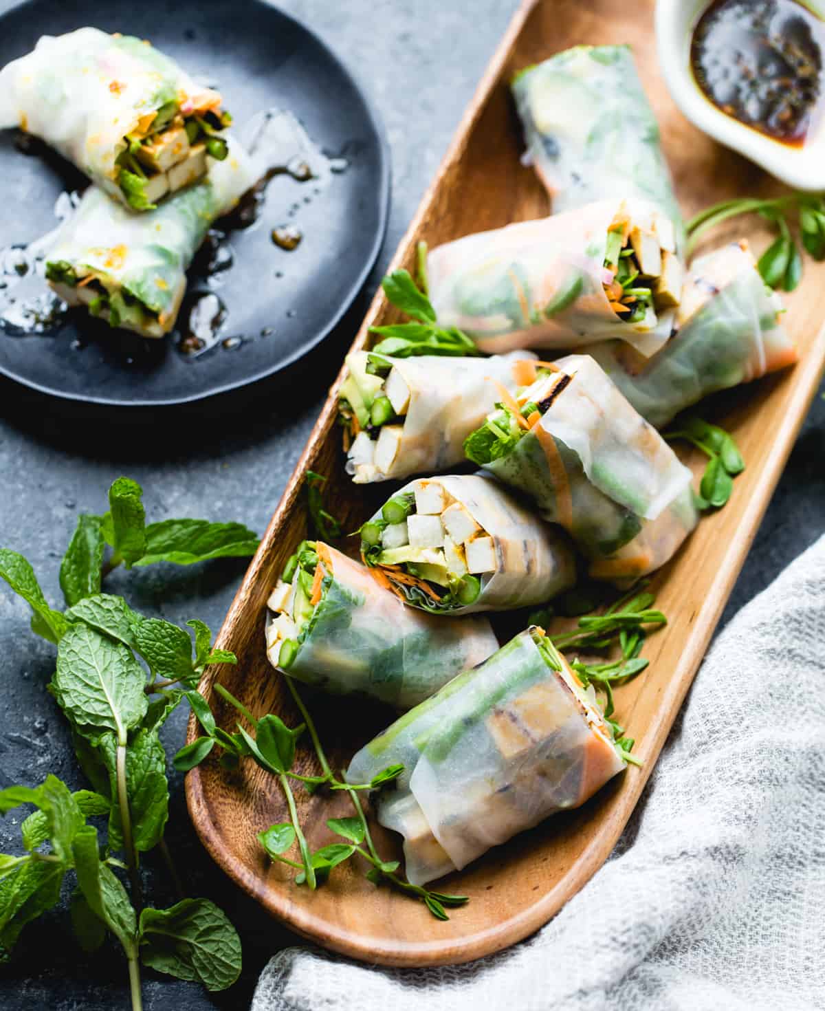 top down shot of Grilled Asparagus Tofu Spring Rolls with Ginger-Lime Dipping Sauce
