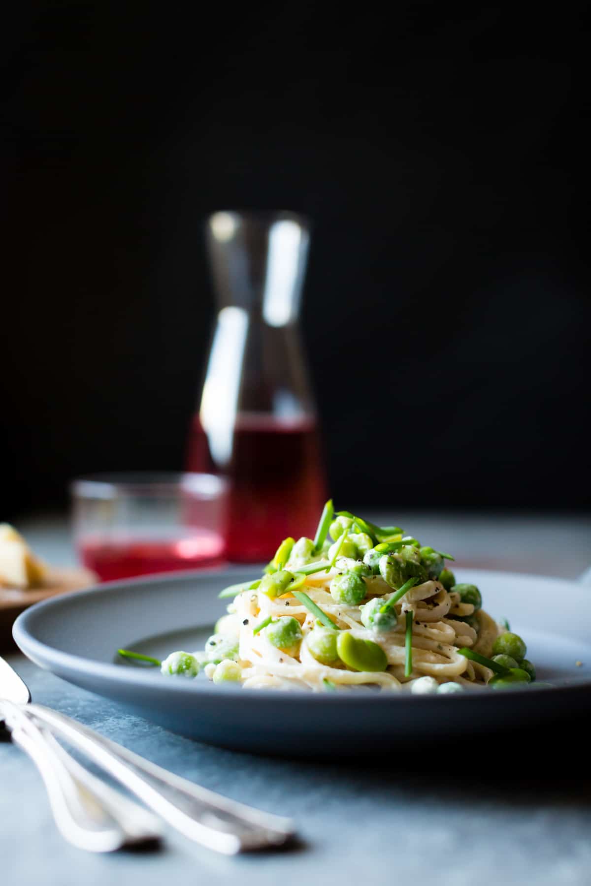 side shot of Creamy Cashew-Miso Pasta with Peas and Fava Beans {gluten-free, vegan option}