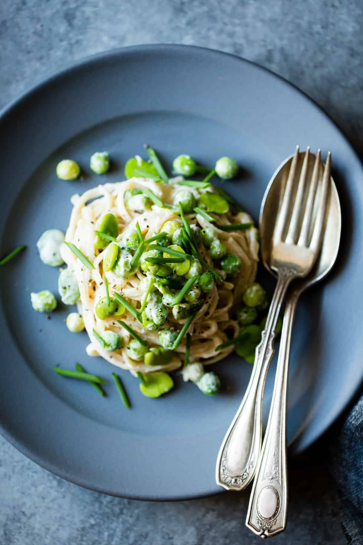 plated Creamy Cashew-Miso Pasta with Peas and Fava Beans {gluten-free, vegan option}