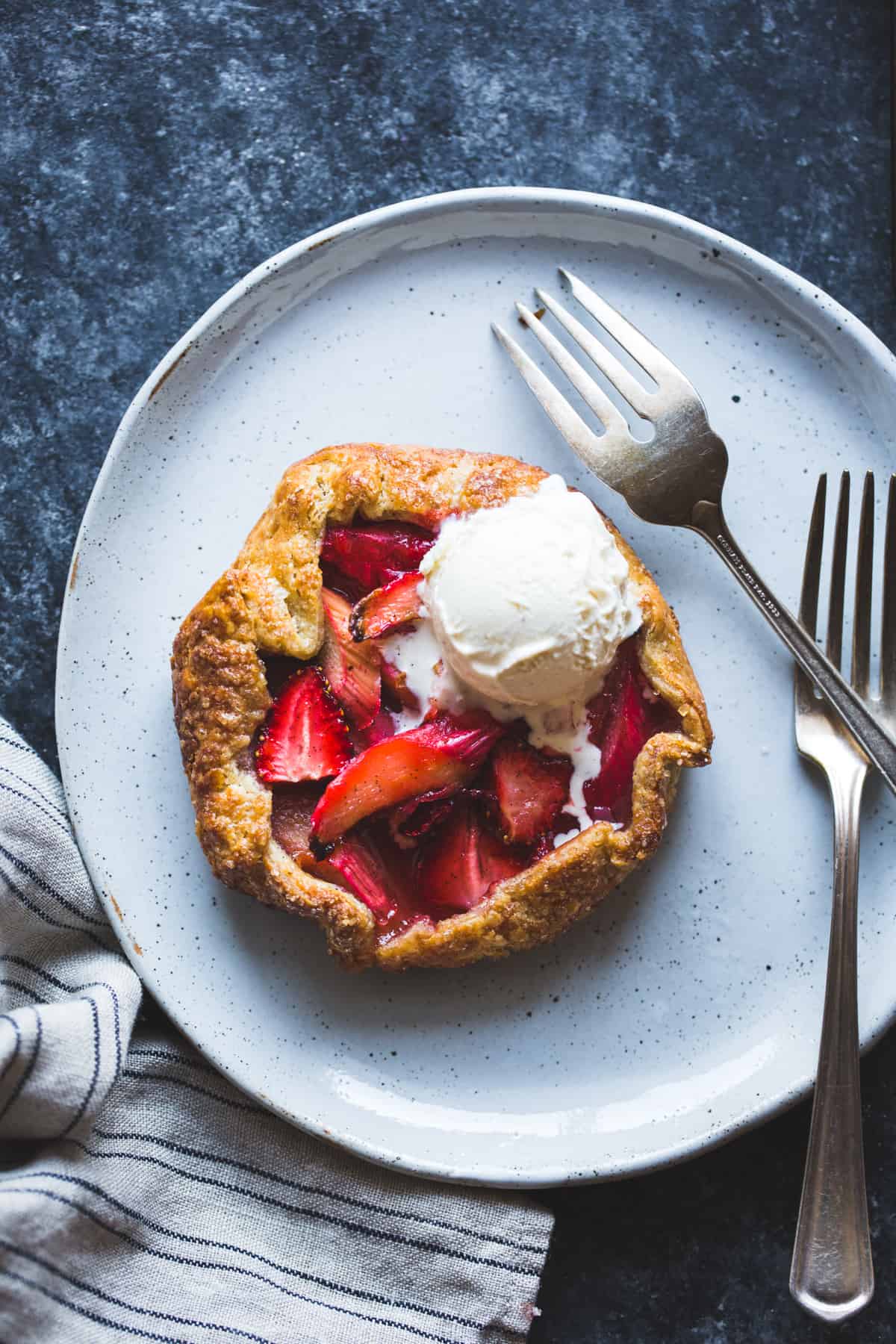 Strawberry Rhubarb Rose Galettes {gluten-free} with forks 