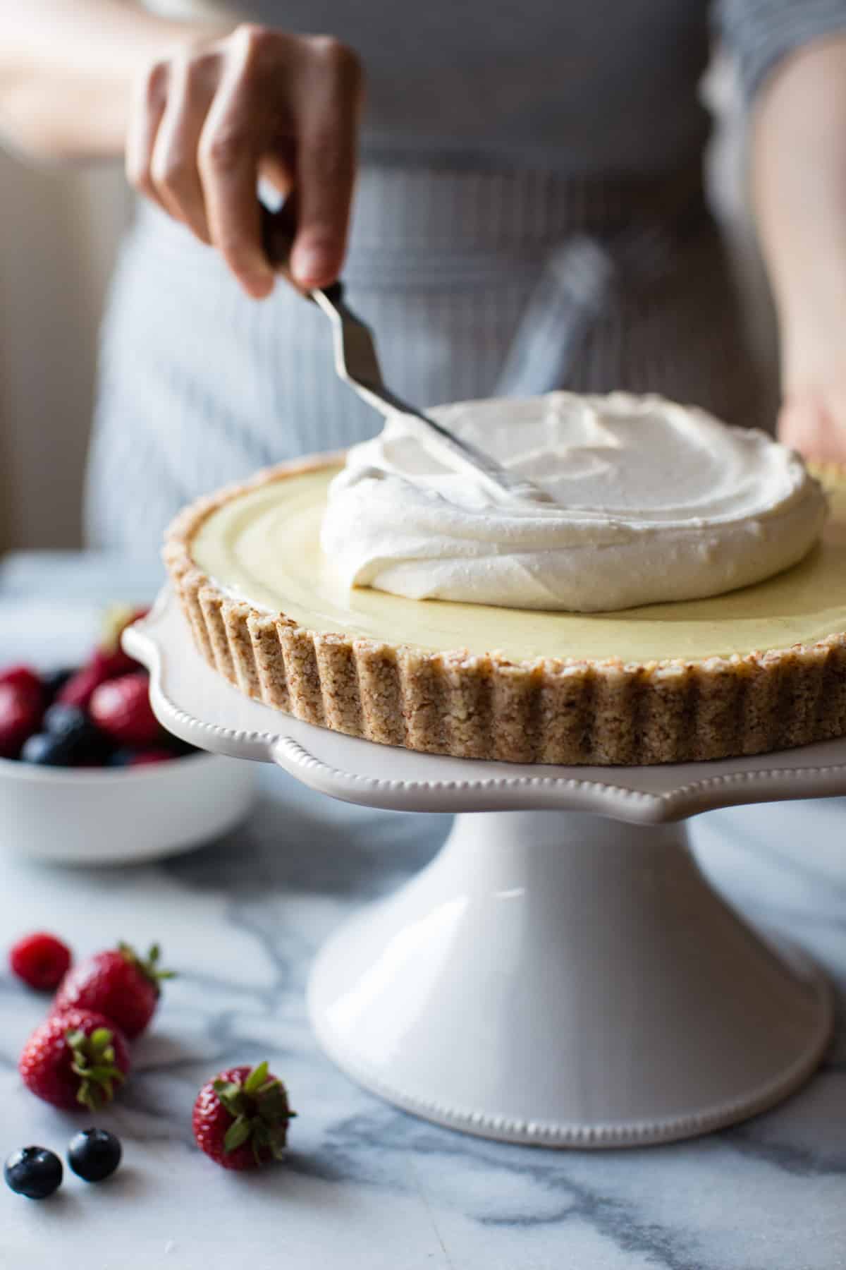 spreading cream on No-Bake Lemon Berry Coconut Cream Tart {vegan, gluten-free, refined sugar-free}