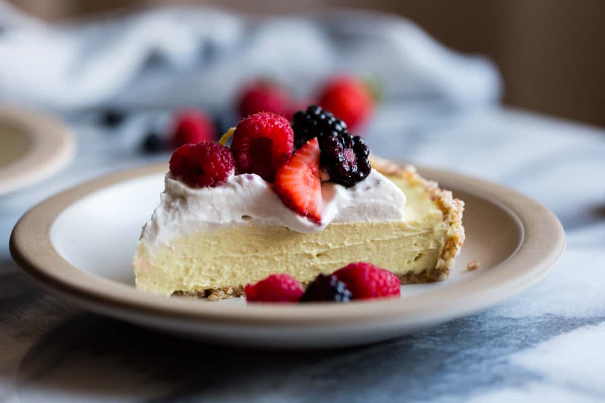 slice of No-Bake Lemon Berry Coconut Cream Tart {vegan, gluten-free, refined sugar-free} on plate 