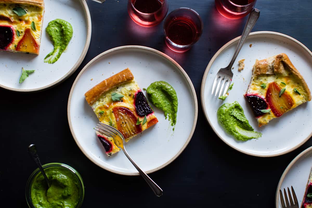 3 plates of Ricotta Beet Tart with Beet Green Pesto