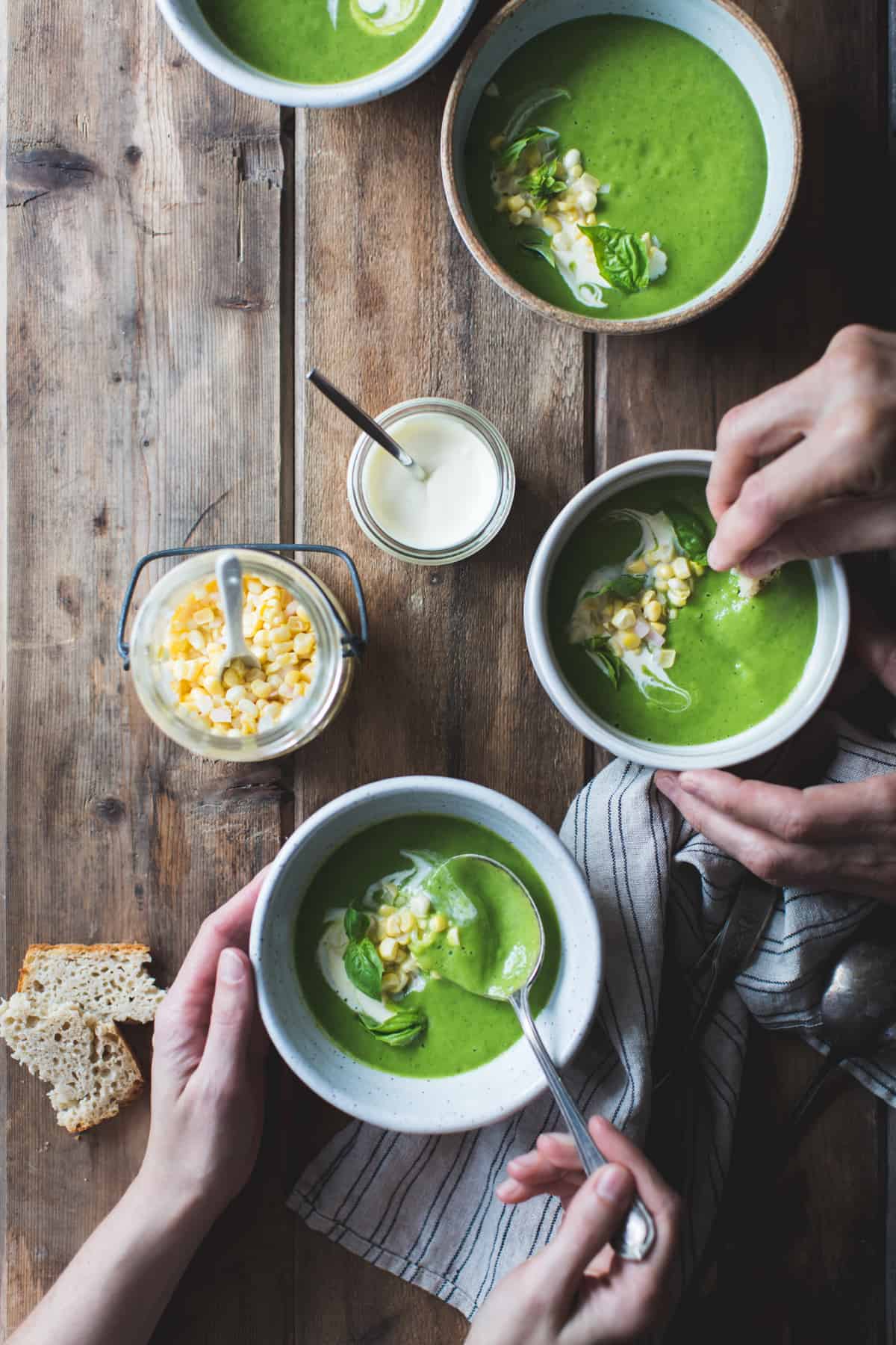 people eating Zucchini Basil Soup with Crème Fraîche and Pickled Corn