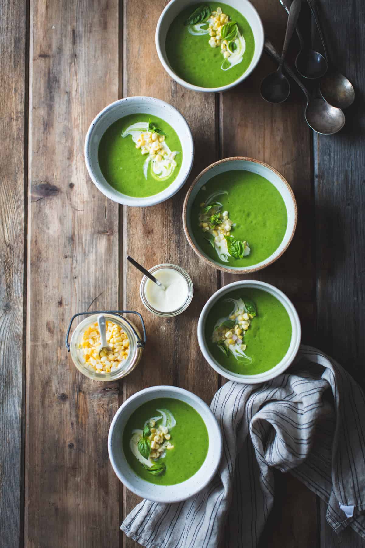 5 bowls of Zucchini Basil Soup with Crème Fraîche and Pickled Corn