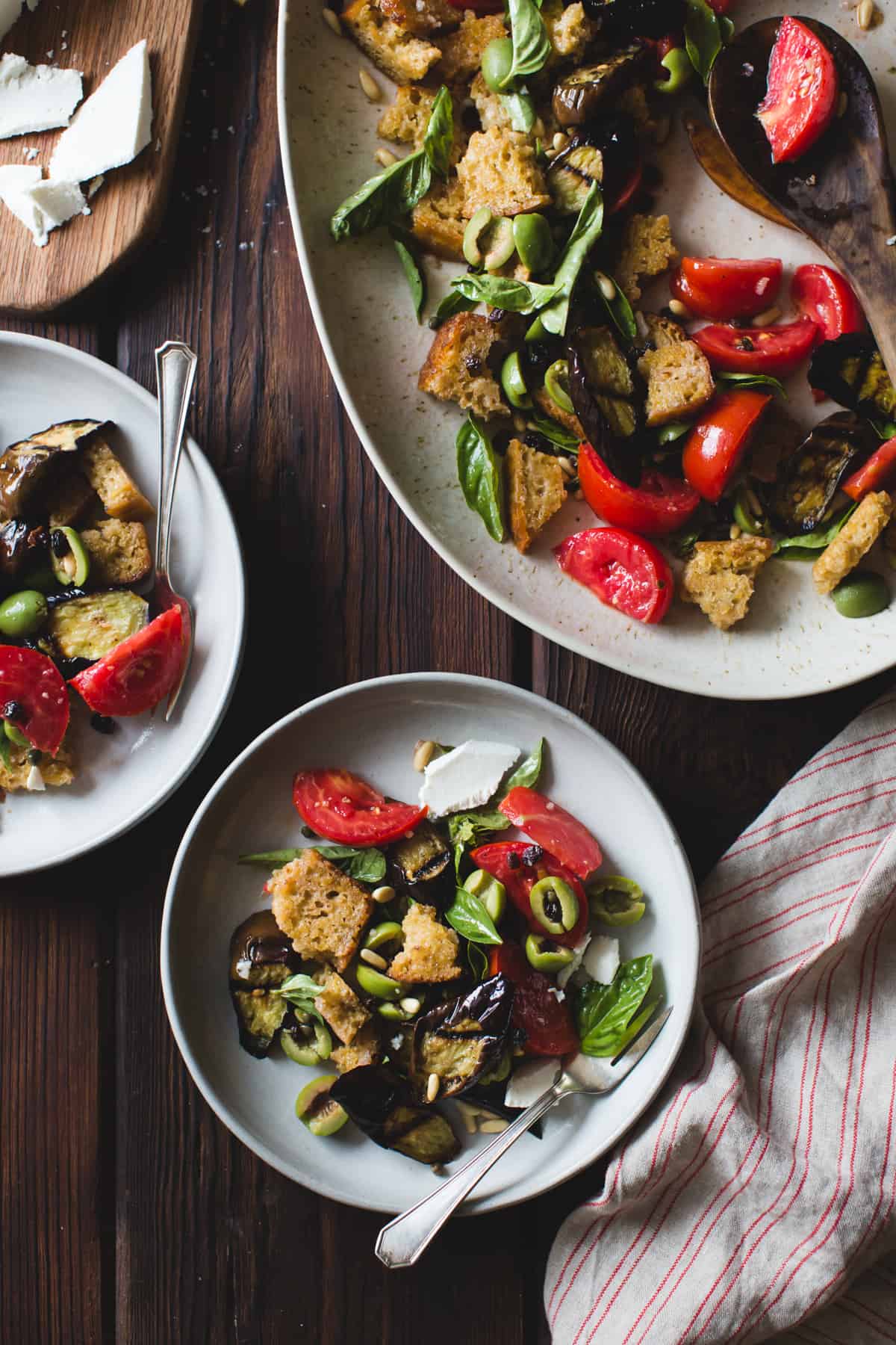 plates of Roasted Eggplant Panzanella with Capers, Olives, and Pine Nuts