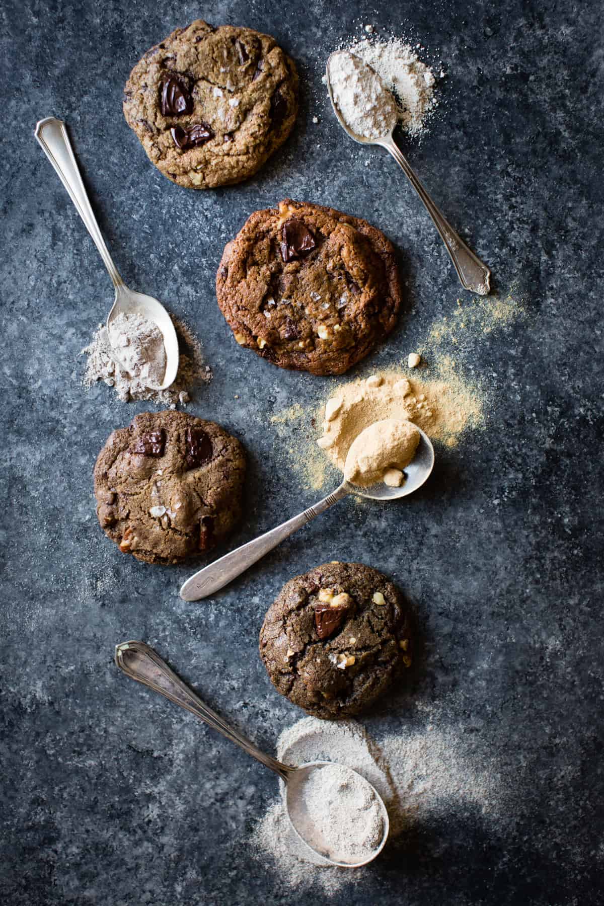 Gluten-Free Chocolate Chip Cookies Four Ways: Oat, Teff, Buckwheat, Mesquite on table 