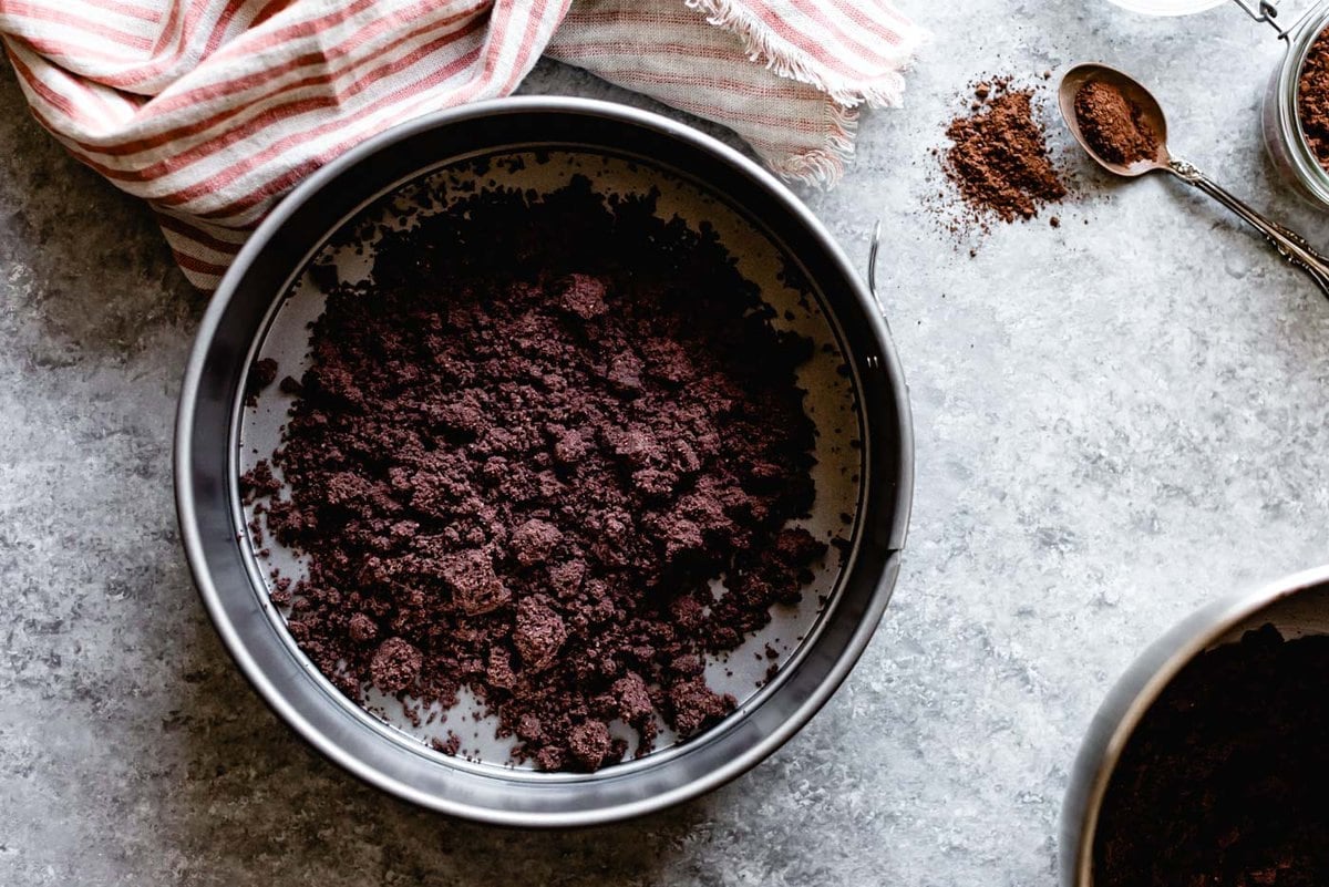 chocolate crust crumbs are in a springform pan