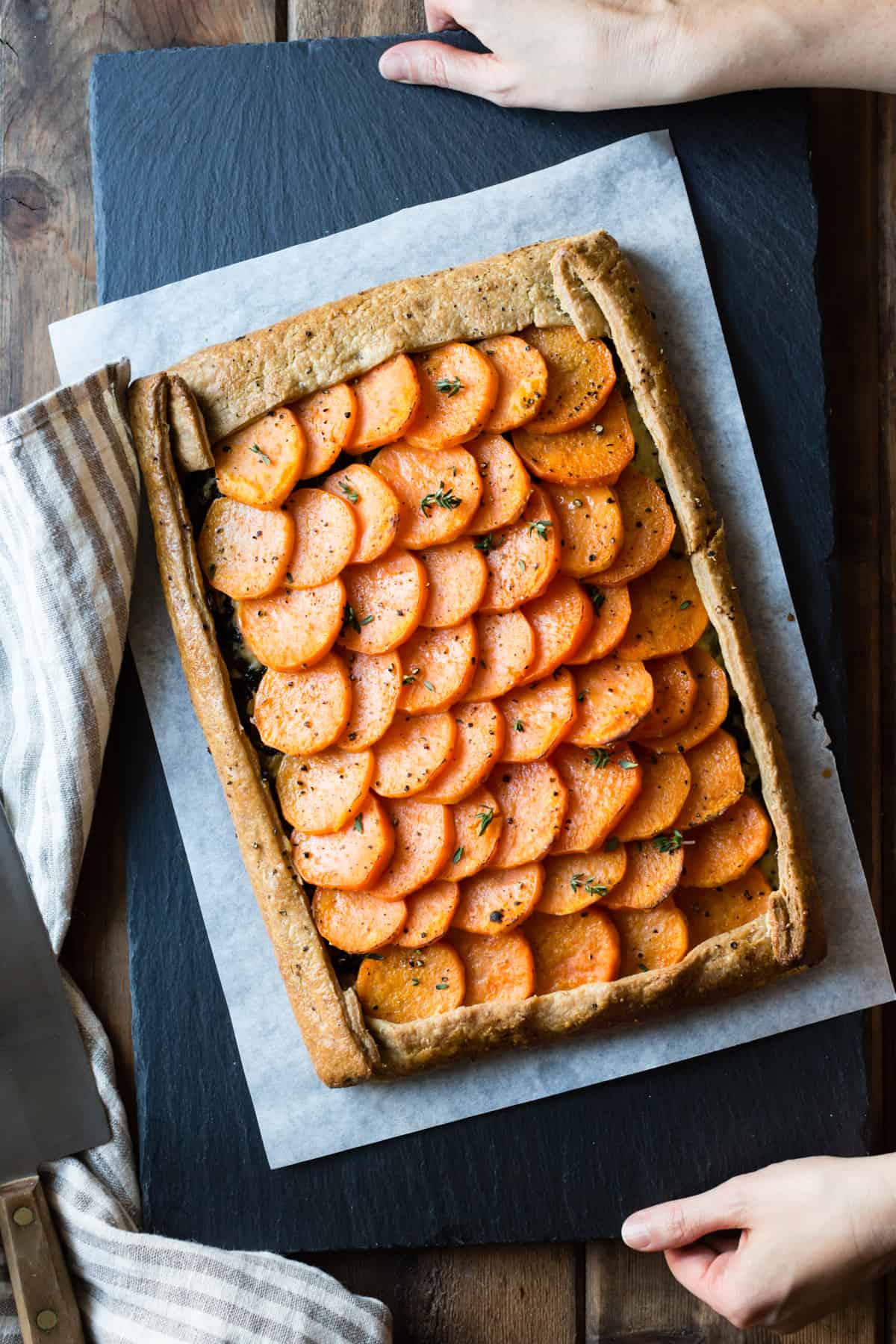 the galette has been baked and placed on a slate serving board