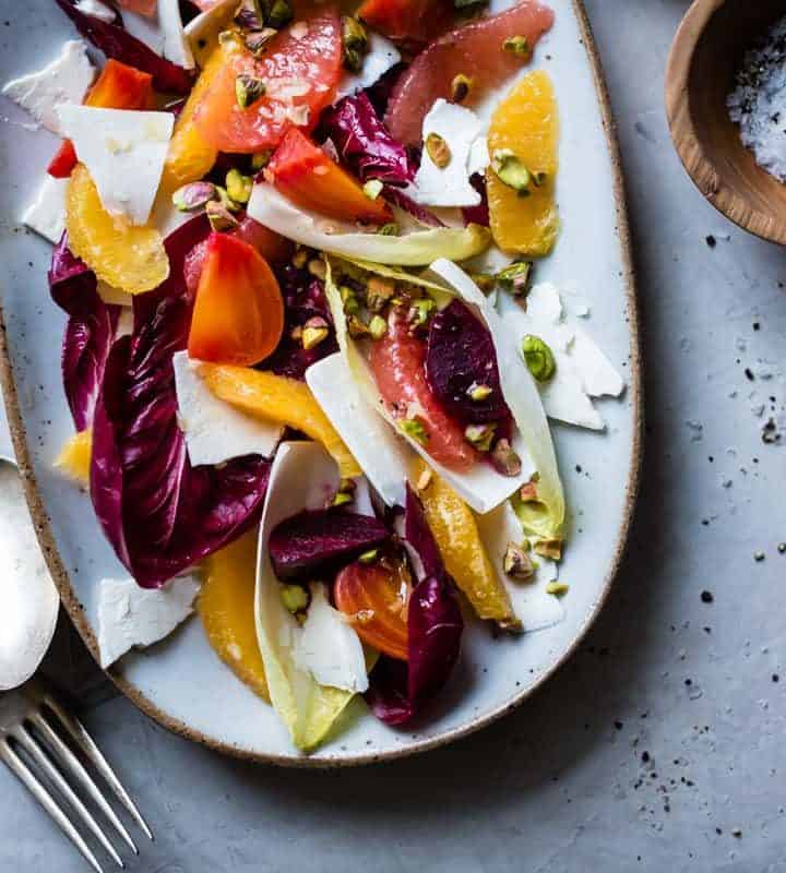 big plate of Beet, Citrus, & Chicory Salad with Ricotta Salata and Pistachios