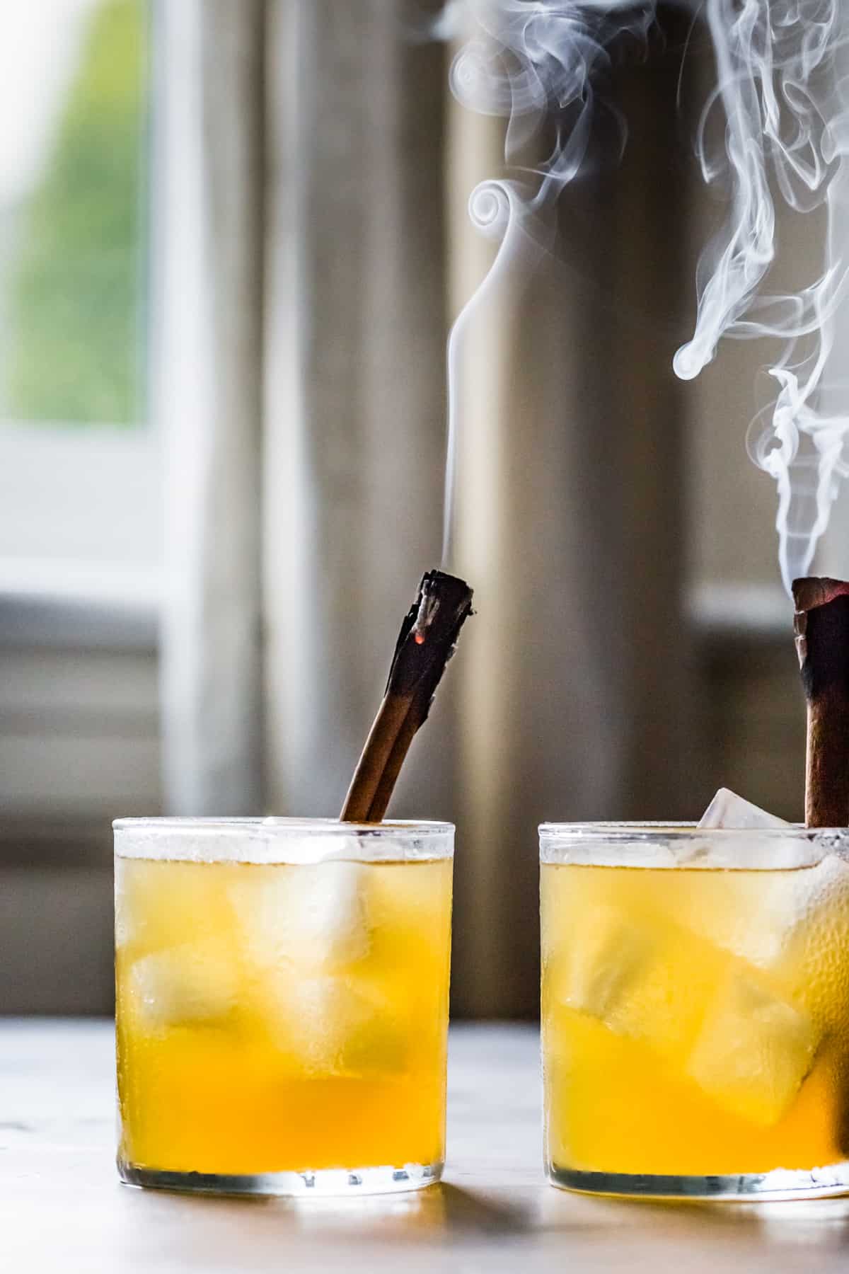 two smokey Yellow Chartreuse Cocktail with Bourbon & Ginger {Honey & Hearth}