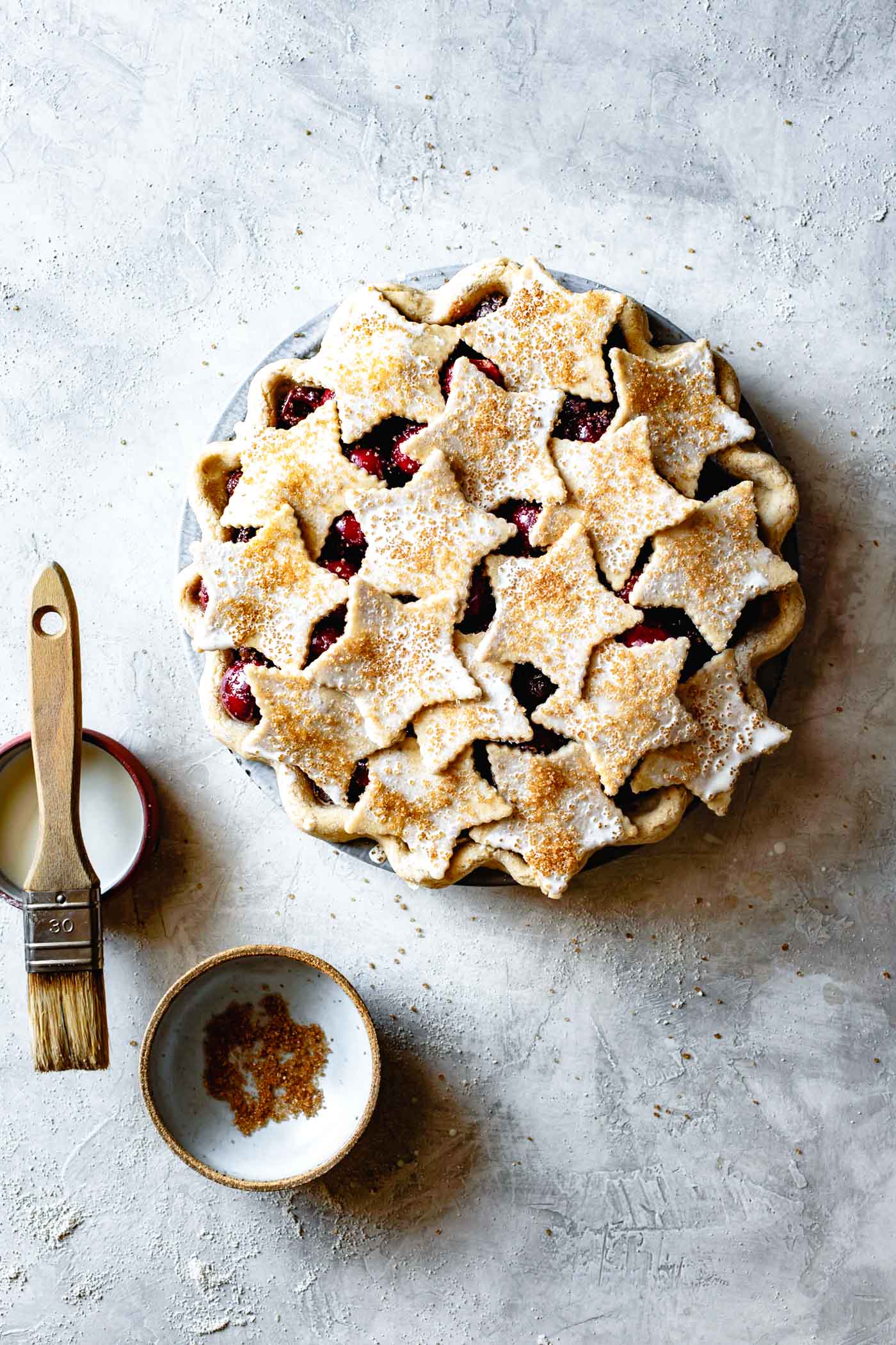 the cut-outs are on top of the pie, sprinkled with sugar and ready to bake