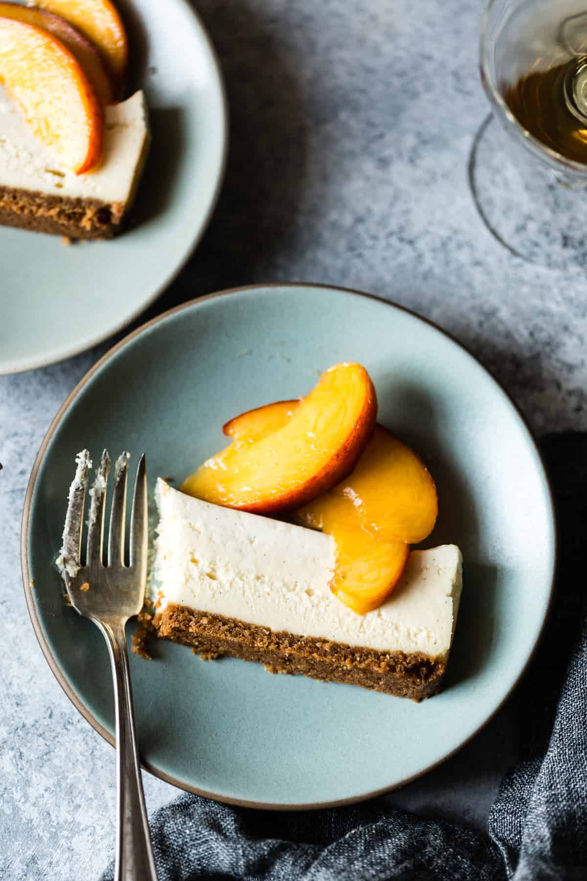 Small Batch Cheesecake with Elderflower Peaches on plate with fork 