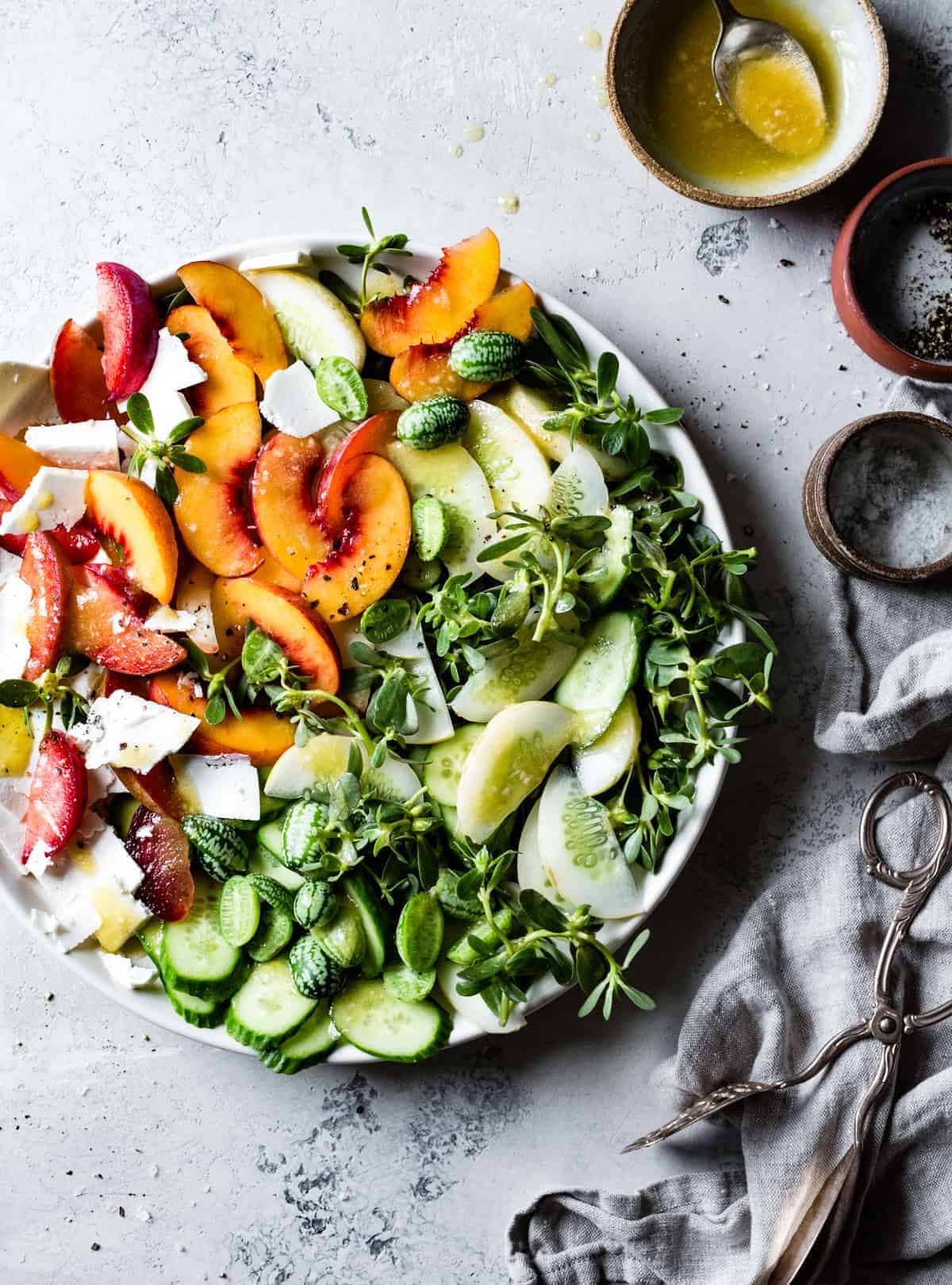 delicious Stone Fruit Cucumber Salad with Ricotta Salata, Purslane, and Golden Balsamic Miso Vinaigrette