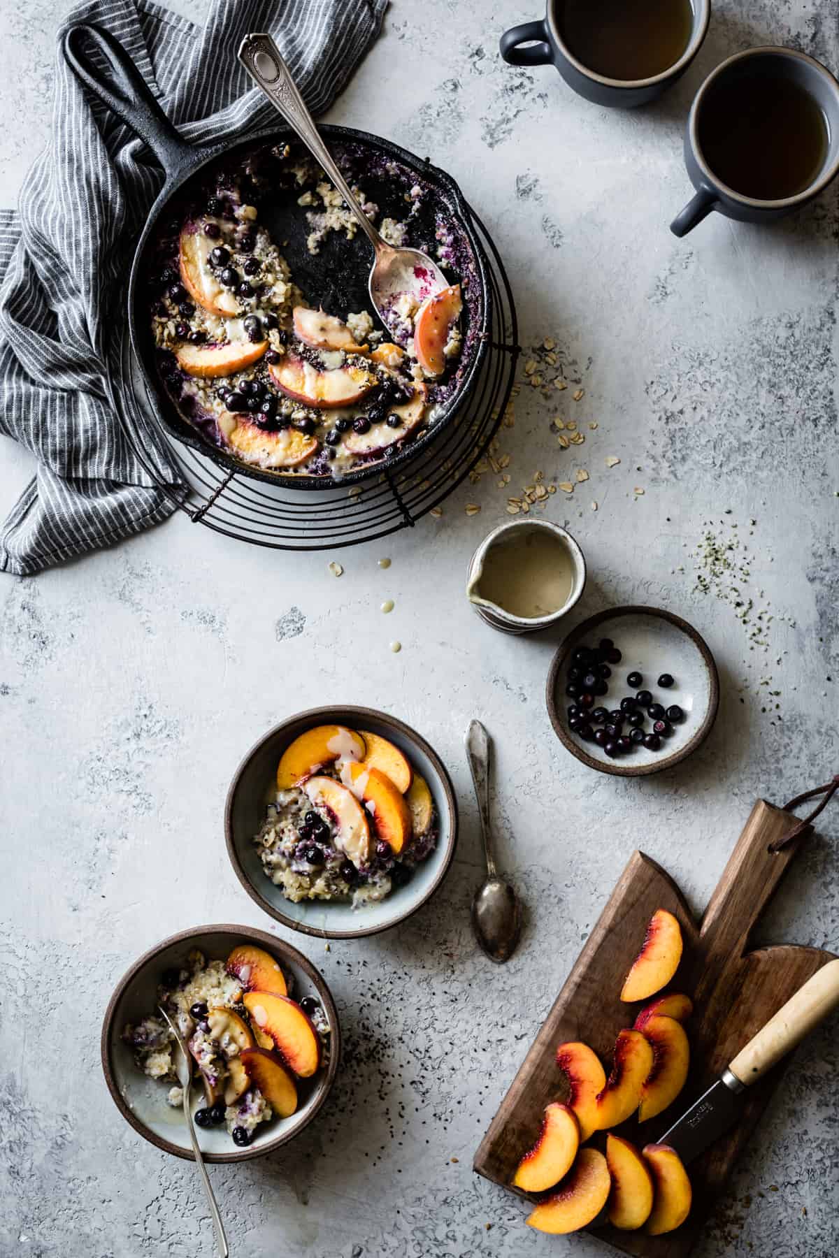 two bowls of Super Seedy Vegan Baked Oatmeal with Peaches and Huckleberries {gluten-free & dairy-free}