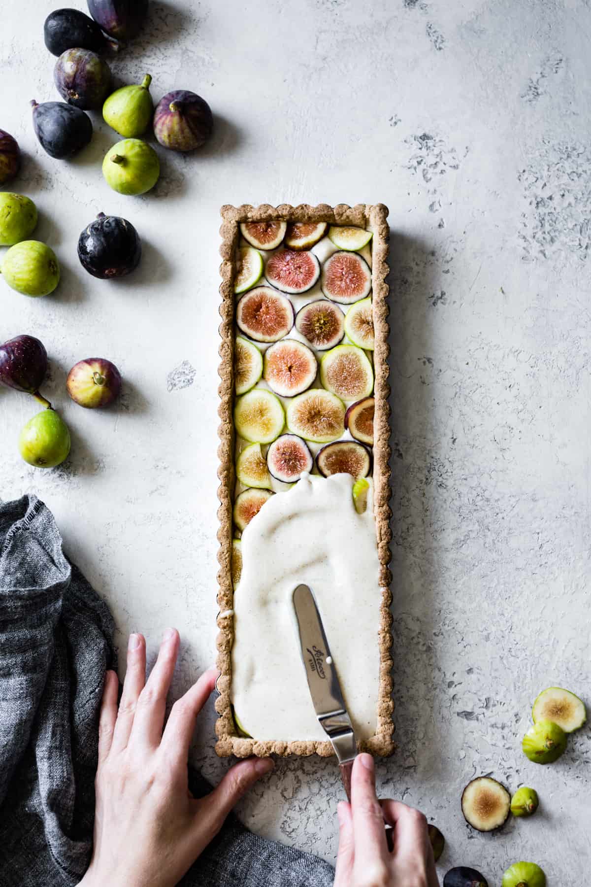 laying topping on Ginger Fig Tart with Chestnut-Almond Crust {vegan & gluten-free}