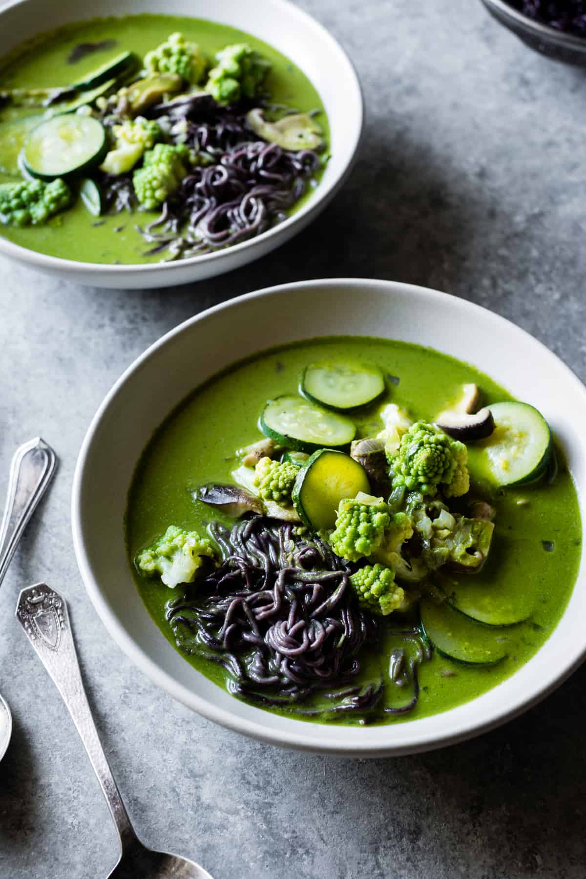 Green Noodle Soup with Coconut Lemongrass Broth in bowls 