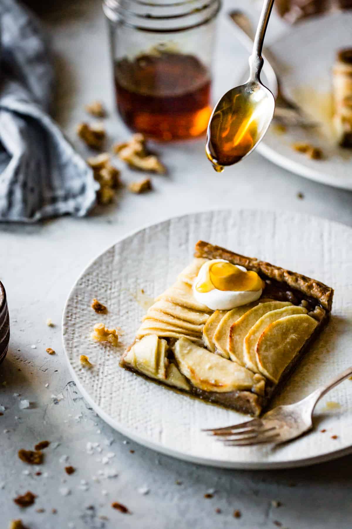 drizzling syrup on Buckwheat Apple Galette with Maple Walnut Frangipane {gluten-free, refined sugar-free}